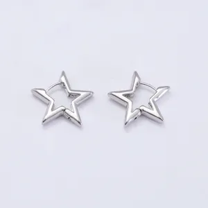 Detailed shot of silver pentagram huggie hoop earrings with geometric hollow design.