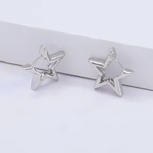Close-up of minimalist star geometric metal hoop earrings, elegant and chic daily jewelry.