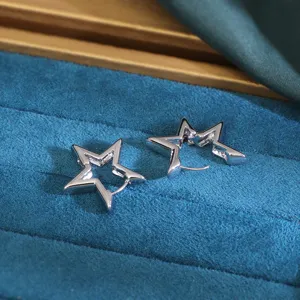 Close up view of hollow star shaped zinc alloy hoop earrings showcasing fine metal details.