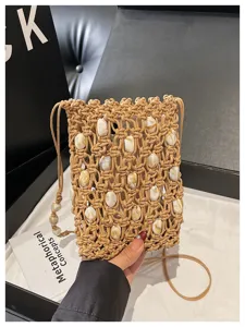 Bohemian macrame beaded phone bag detailed view, woven crossbody pouch for beach vacation.