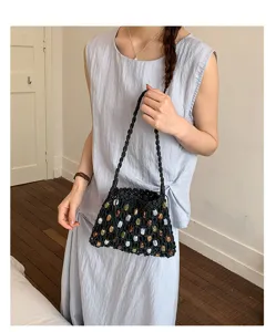 Bohemian black woven shoulder bag with colorful beads, perfect for summer beach and vacation.