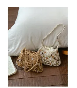 Bohemian beaded woven shoulder bag detail, textured wax rope straw beach handbag for summer.