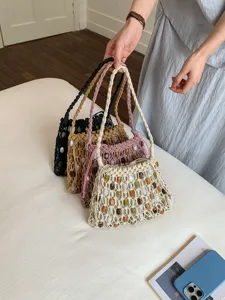 Bohemian wax rope woven beaded shoulder bag women beach vacation straw bag main view.