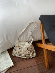 Bohemian wax rope woven handbag for women, stylish beaded straw shoulder bag for summer beach vacation.