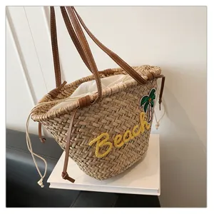 Sac à main en paille tressée pour femme, grand cabas de plage avec anses en cuir et cordon.