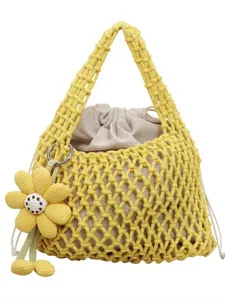 Yellow cotton woven mesh handbag with beige drawstring inner pouch and cute flower charm main view