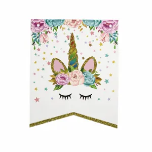 Unicorn birthday paper banner flag detail shot with glitter and floral design for party decor.