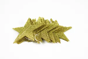 Close-up detail of golden glitter star paper garland string, shiny party decoration props.