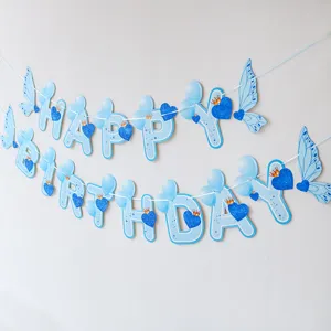 Blue butterfly birthday banner detail showing glitter heart and letter design for party decor.