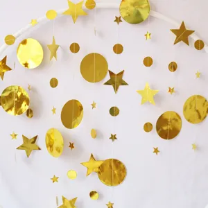 Gold star and circle paper garland detail showing the shiny reflective surface for party decor.