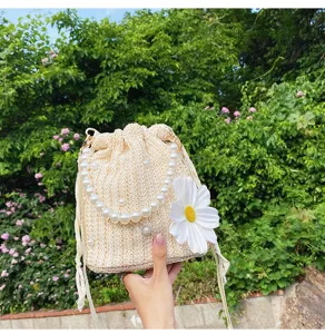 Woven bucket bag with pearl chain and daisy flower, vacation beach crossbody handbag.