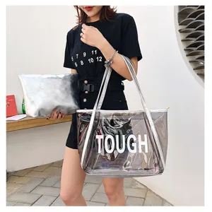Detailed view of clear jelly tote bag with lettering, lifestyle shot on model for beach use.