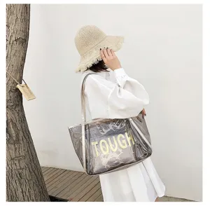 Detailed shot of transparent jelly tote bag with inner pouch, summer beach style, clear view.