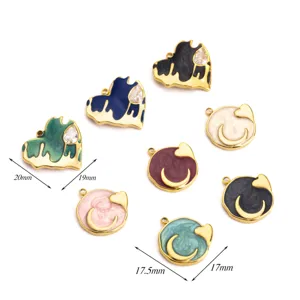 Detail view of stainless steel enamel heart and moon charms, showing close-up craftsmanship.