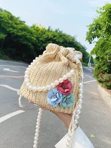 Fresh Floral Woven Bucket Bag Straw Beach Bag With Artificial Pearl Chain Vacation Style Drawstring Crossbody Bag For Women