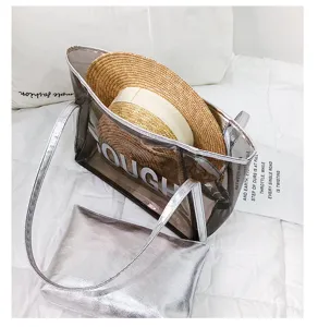 Clear jelly tote bag with straw hat detail, spacious beach shoulder bag for summer vacation.