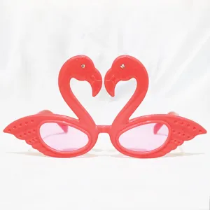 Pink flamingo novelty party sunglasses, funny photo booth props, cute holiday dress up eyewear.