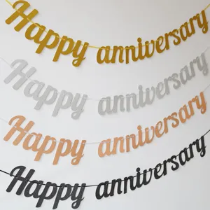 Glitter happy anniversary banner detail shot showing multi-color party decoration flags.