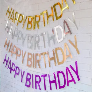Detail view of colorful mirror finish happy birthday hanging banner party decoration garland
