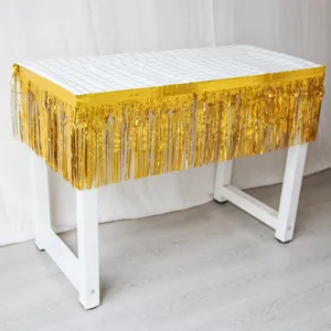 Gold foil fringe curtain detail shot, perfect for birthday party and wedding decor display.
