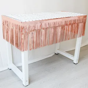 Rose gold tinsel fringe curtain and grid tablecloth for birthday party and wedding decor.