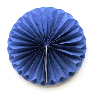 Detailed close-up showing the folded blue paper honeycomb ball texture and circular structure.