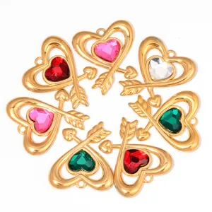 Close-up of colorful rhinestone heart pendants with arrow design for DIY jewelry making details.