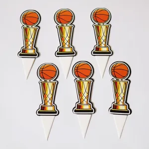 Detailed shot of six basketball trophy cupcake toppers, ideal for sports party decor.