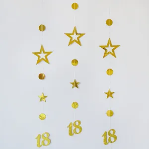 Gold foil 18 birthday party hanging garland detail view with stars and circles decoration