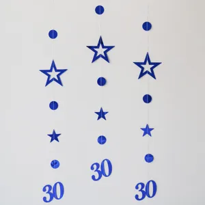Blue hanging party garland with hollow stars circles and number 30 for birthday celebrations.