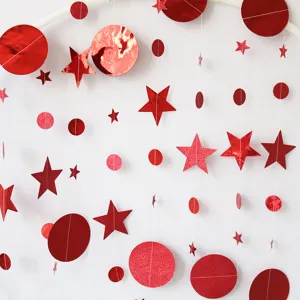 Detailed shot of red laser paper star and circle garland, perfect for party decoration.