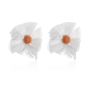 Close-up detail view of handcrafted white chiffon fabric flower earrings with elegant orange center.