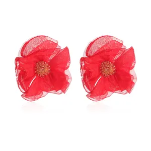 Detailed close-up of handmade red chiffon flower stud earrings featuring gold-tone wire pistils.