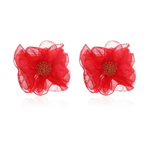Red chiffon fabric flower earrings with metal stamen detail, elegant handmade jewelry style.