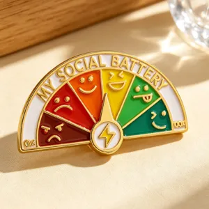 Macro detail of My Social Battery enamel pin with sliding mood gauge design