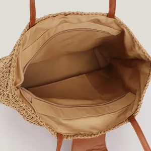 Innenansicht einer gewebten Papierschnur-Schultertasche mit Reißverschlussfächern