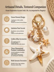 Macro detail view of ocean-themed keychain featuring starfish, shell, and pearl charms
