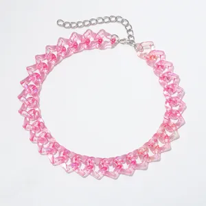 Close-up detail of the pink acrylic heart link chain necklace, transparent resin links.