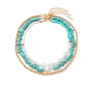 Boheemse meerlaagse turquoise kralen ketting met parels en gouden kettingdetails