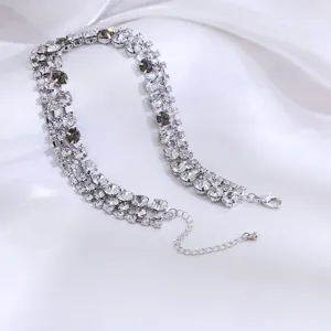 Detailed view of a multi-row rhinestone choker necklace, sparkling crystal collar accessory.