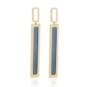 Close-up detail of geometric long drop earrings with double-layer metal and blue inlay design.