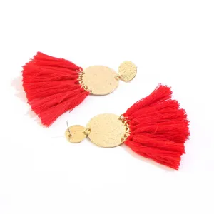 Boho red tassel earrings with gold textured discs, long drop fashion jewelry for women.