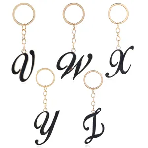 Exquisite metal alphabet keychain with black enamel letter pendant for bags and gifts.