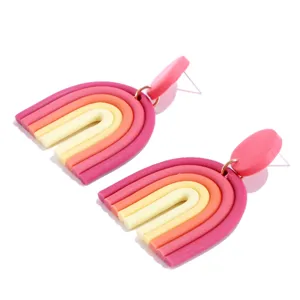 Handmade polymer clay rainbow earrings, colorful geometric U-shaped dangle details.