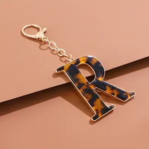 Schicker Leopardenmuster Acetat Buchstabe R Schlüsselanhänger mit goldfarbenem Metall Zubehör