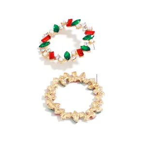 Christmas wreath rhinestone circle earrings feature red green gems and gold tone metal style.