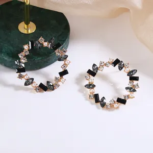 Fashion vintage geometric round earrings with black stones, rhinestones and pearls.