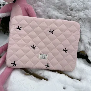 Pink quilted laptop sleeve with embroidered bows and storage bag for 11 13 15 inch tablets.