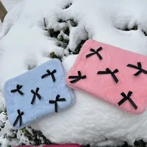 Cute plush laptop sleeve with black bows, soft fluffy computer bag for daily use and travel protection.