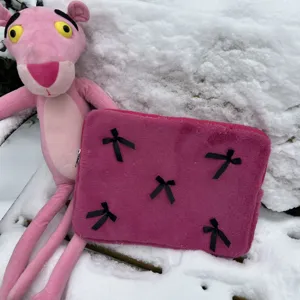 Cute pink plush laptop sleeve with black bows, soft notebook bag storage for 11 13 15 inch women